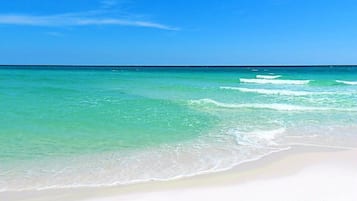 On the beach, sun loungers, beach towels