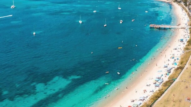A coastal beach with clear turquoise waters, a sandy shore, and a mountainous backdrop. - Shore Thing - Shoal Bay (Shoal Bay)