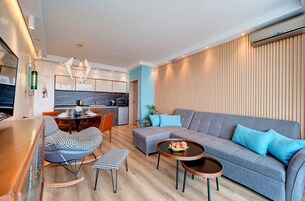 Luxury Apartment, 1 King Bed with Sofa bed, Sea View, Beachfront | Living area | 45-inch LED TV with digital channels, TV, smart speakers