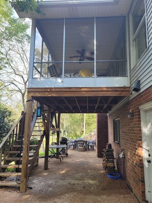 Enjoy the expansive deck with seating and a ceiling fan above.