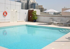 Outdoor pool, lifeguards on site - CARE Holiday Homes Apartments Barsha Heights (Dubai)