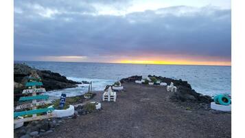 On the beach, sun loungers