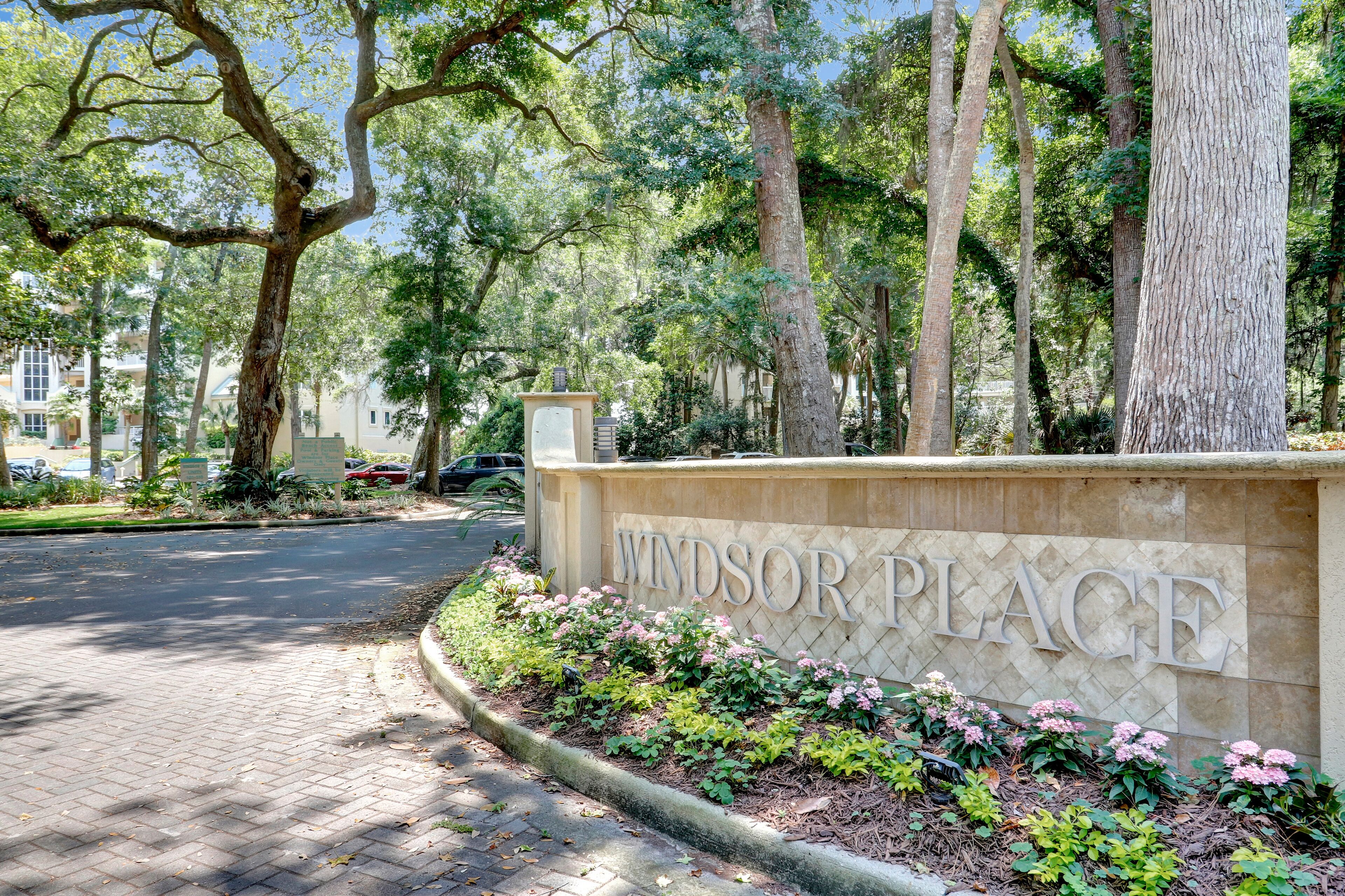 A landscaped area with a sign reading "Windsor Place."
