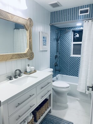 Combined shower/tub, hair dryer, towels, soap