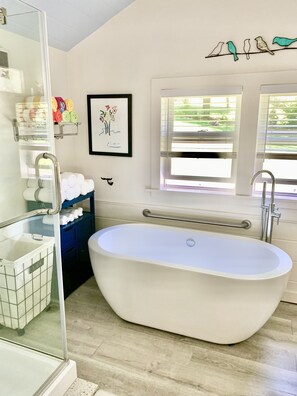 Bathtub, hair dryer, towels, soap