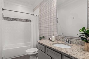 Bathtub, hair dryer, towels, soap