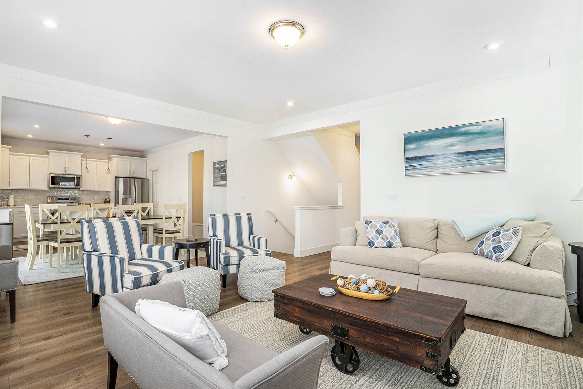 Open living space with comfy seating and a full kitchen.