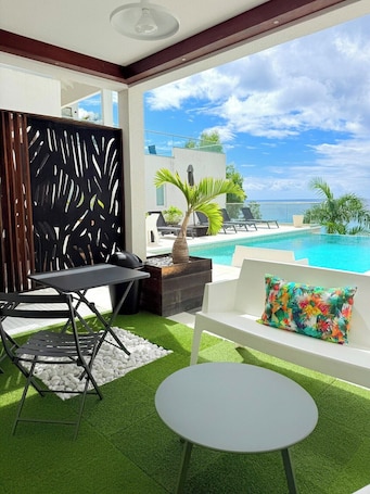 Outdoor dining. Cosy (Apt7) - Patio, Sea View and pool
