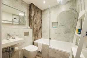 Shower, hair dryer, towels