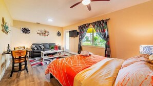A cozy room with a bed, a sofa, a dining table, and a TV. - ✨ #3 Studio close to Bike Rental and Beach (Fort Lauderdale)