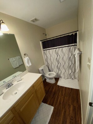 Combined shower/tub, towels, soap, toilet paper