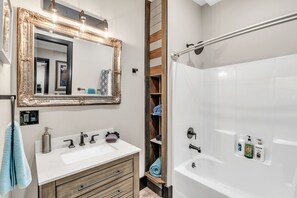 Combined shower/tub, hair dryer, towels, soap