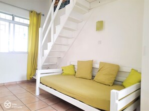 Family Bungalow | Living area | Flat-screen TV, toys - Gîte Cannelle (Saint-François)