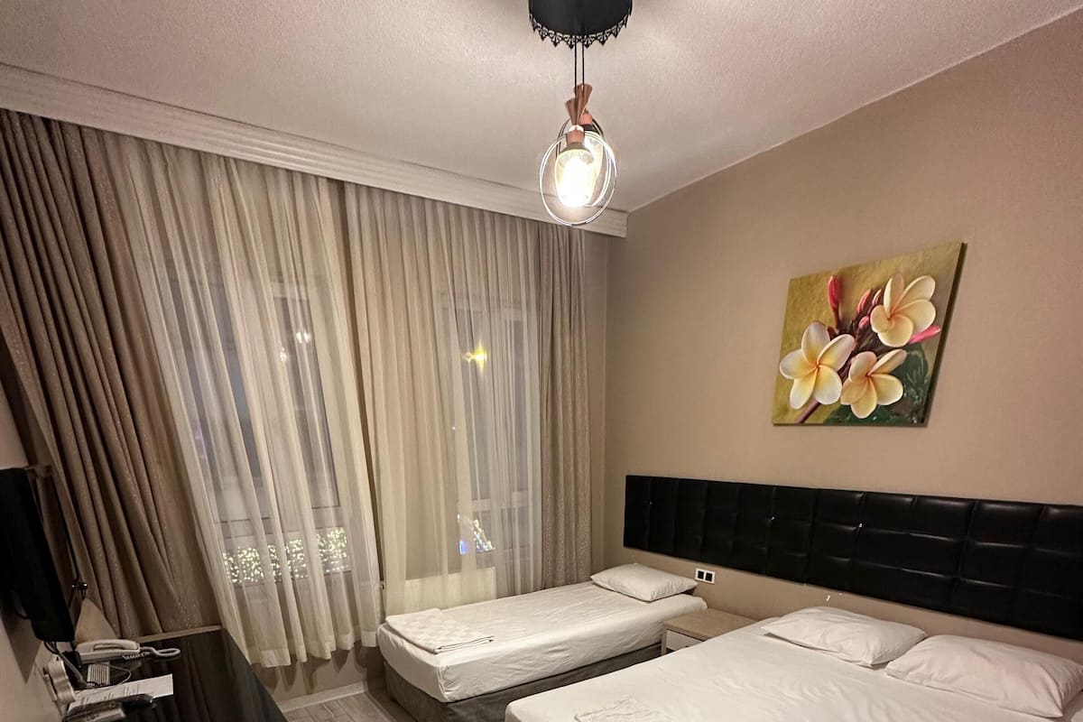 Family Triple Room | Egyptian cotton sheets, premium bedding, minibar, laptop workspace