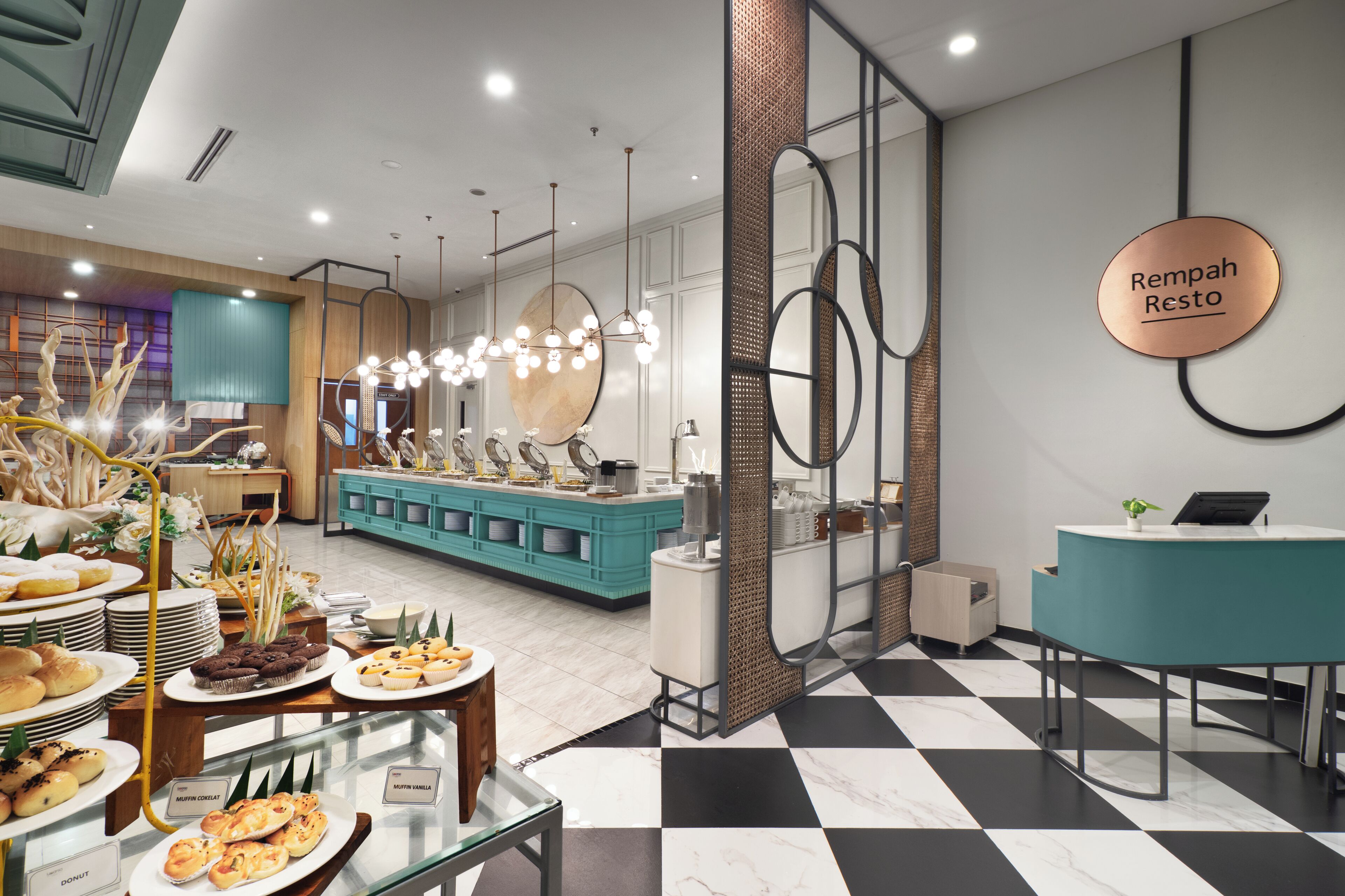 A modern cafe interior with a checkered floor, a counter with a sign reading 'Rempah Resto', and a buffet area with various food items.