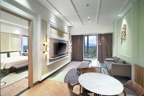 Suite Room King | Living area | 48-inch LED TV with cable channels, TV