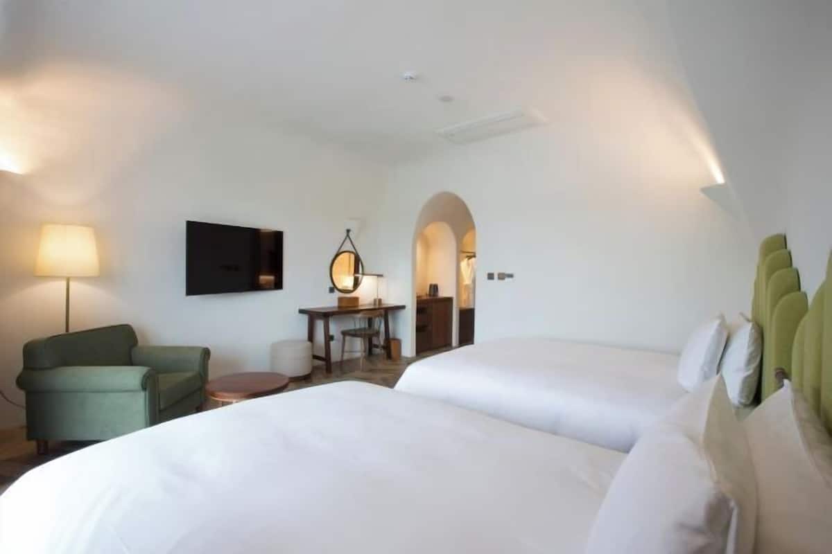 Premium bedding, down duvets, in-room safe, desk