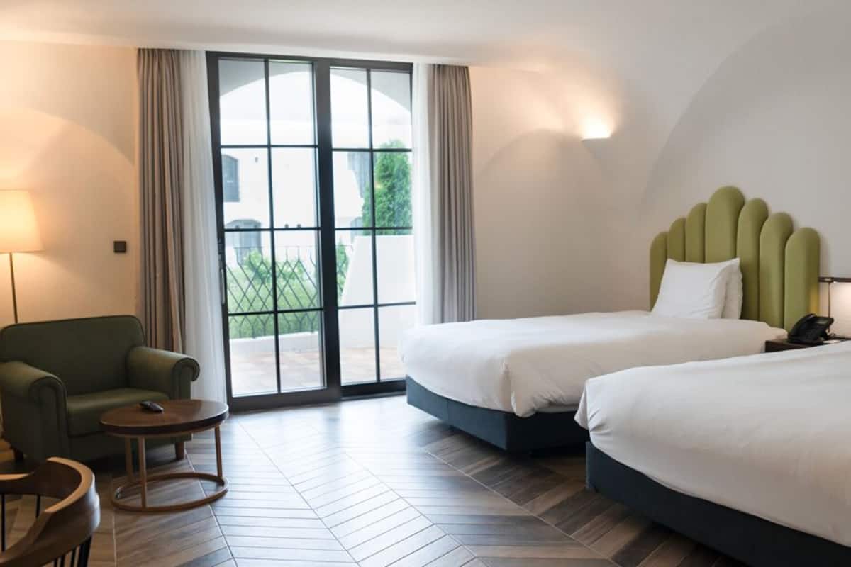 Deluxe Twin Castle | 1 bedroom, premium bedding, down comforters, in-room safe