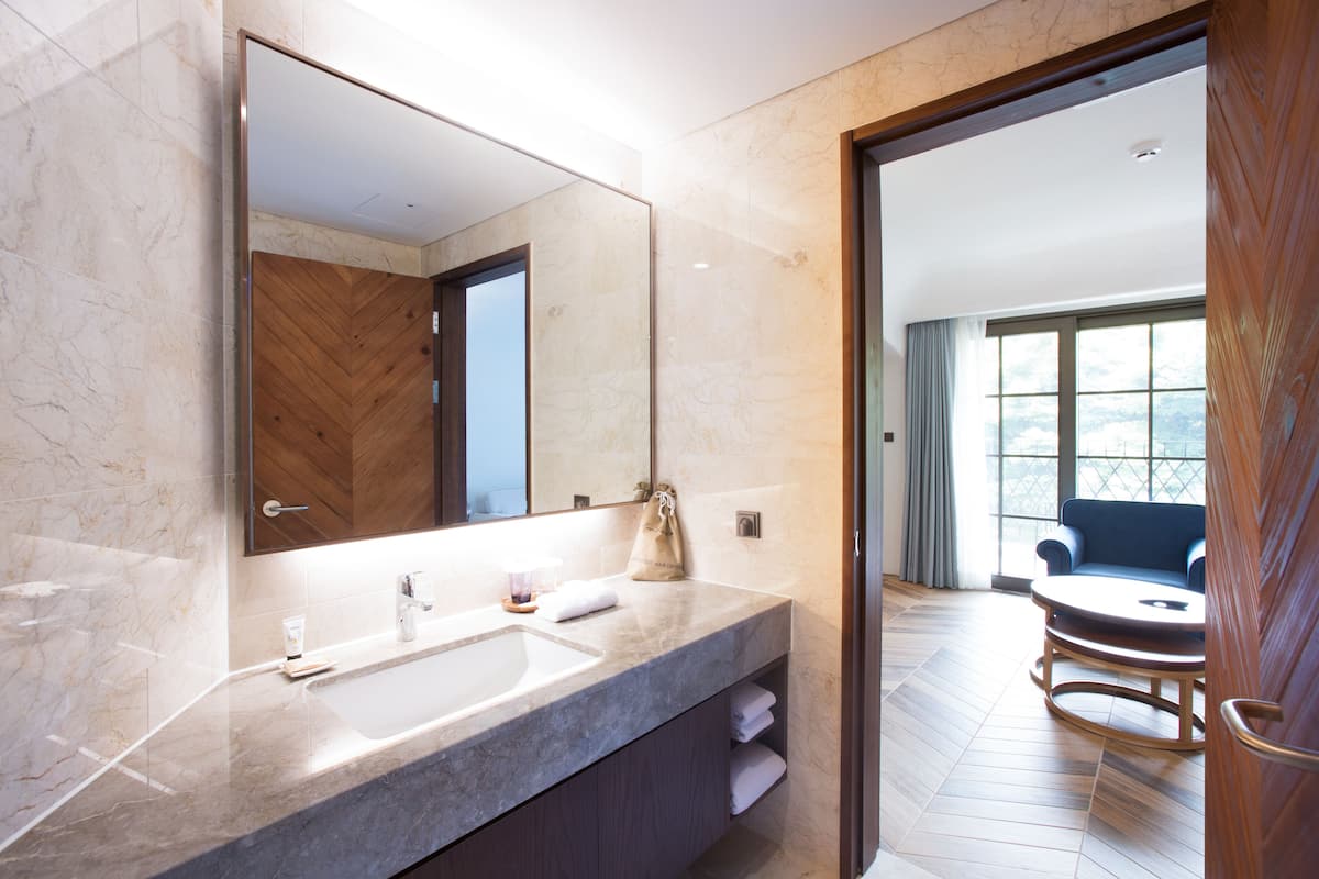 corner suite | bathroom | hair dryer, bathrobes, slippers, bidet