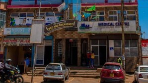 A multi-story building with signs for 'The Trumpet Inn' and 'Medical Centre'. - The Trumpet Inn (Nyeri)