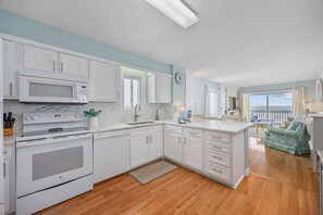 Full-sized fridge, microwave, dishwasher, coffee/tea maker