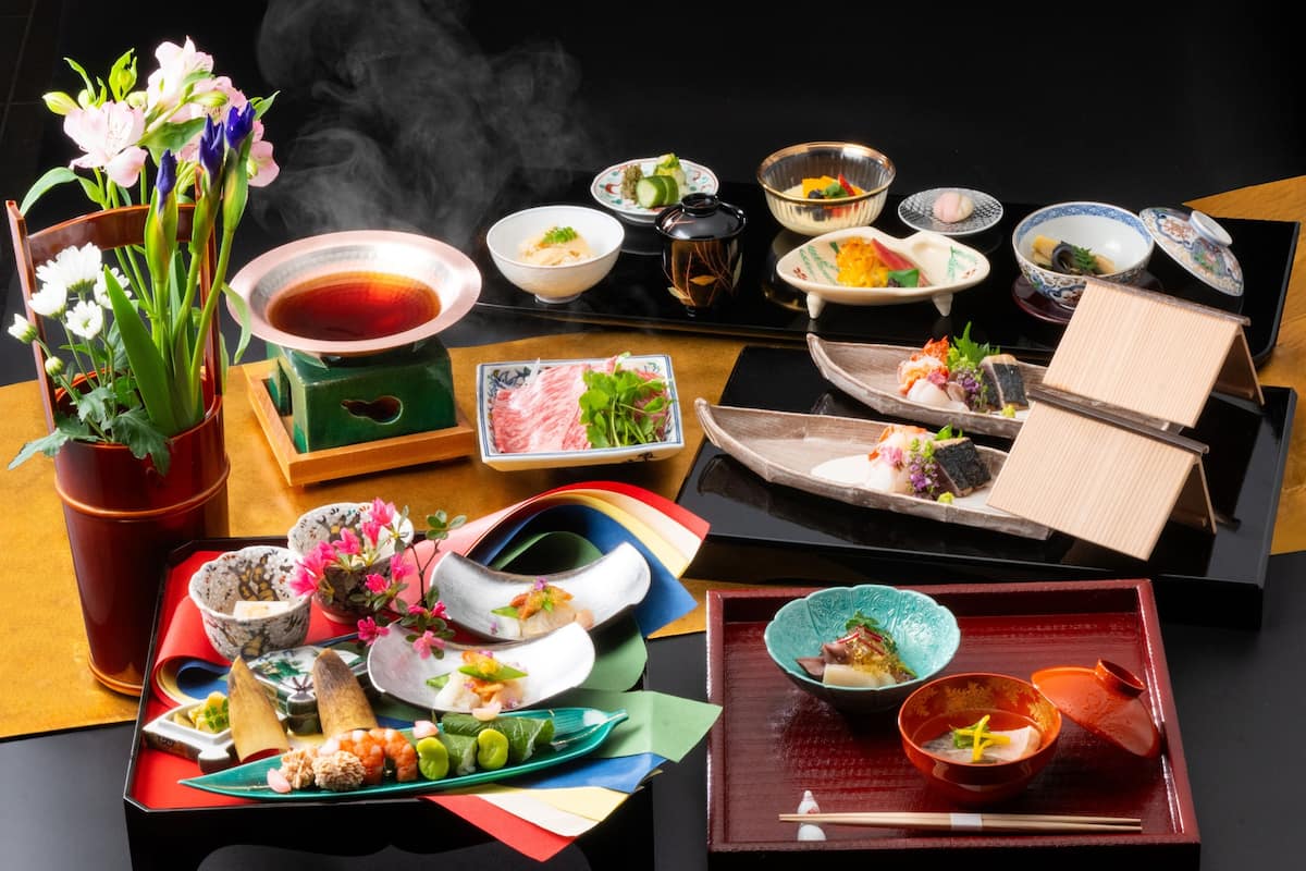 A variety of traditional Japanese dishes arranged on a table.