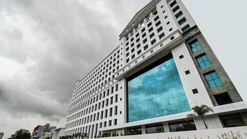 A modern building with a large glass facade and a grid-like exterior.