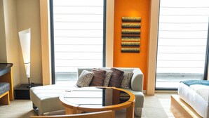 A hotel room with a bed, a sofa, a round table, and a lamp. - KOKO HOTEL Premier Kanazawa Korinbo (Kanazawa)