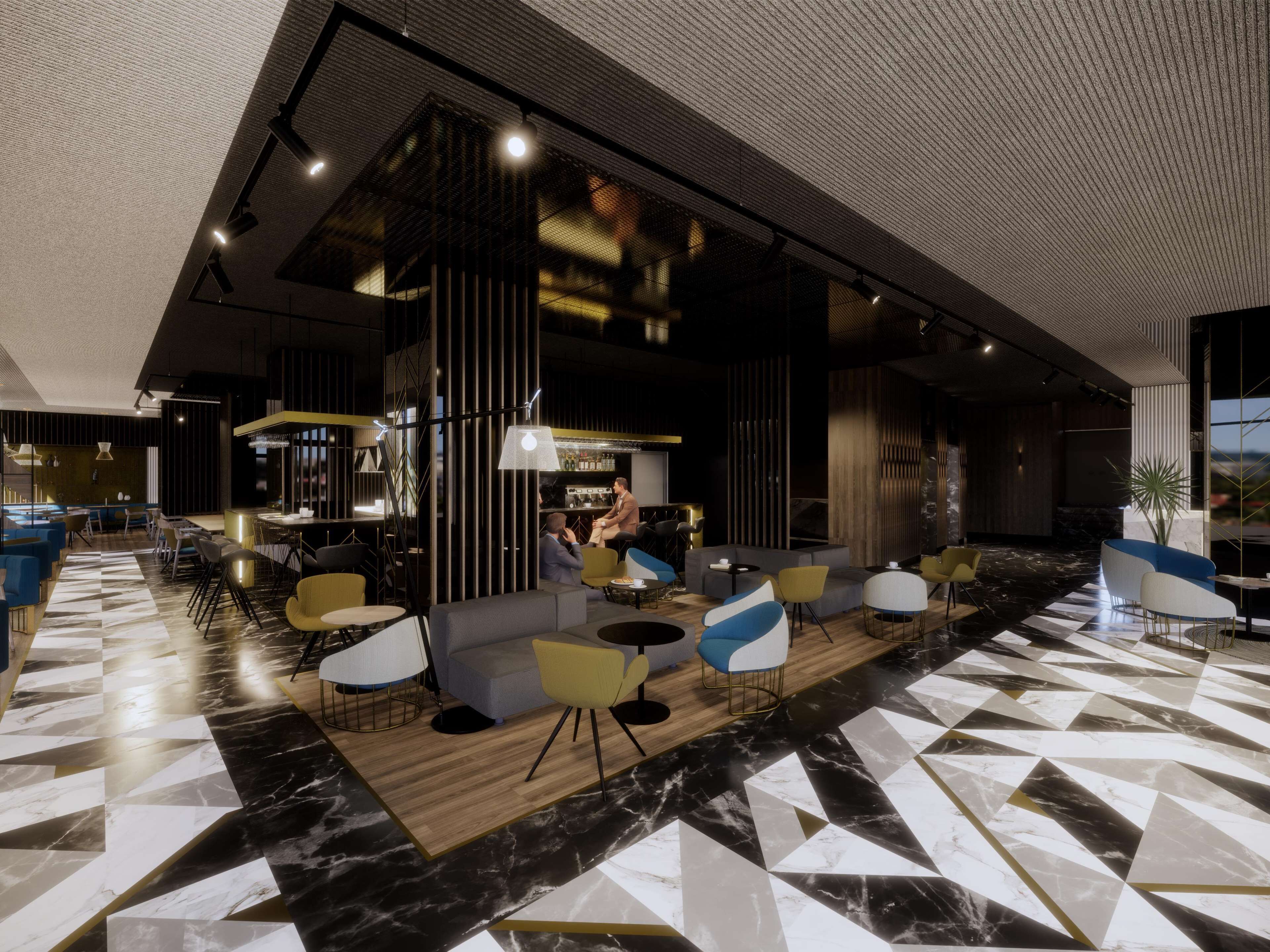Een modern interieur met een bar, zitplaatsen met tafels en een vloer met patroon.