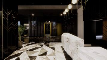 A modern lobby with a geometric marble floor, a reception desk, and a dark, striped wall with a golden door.