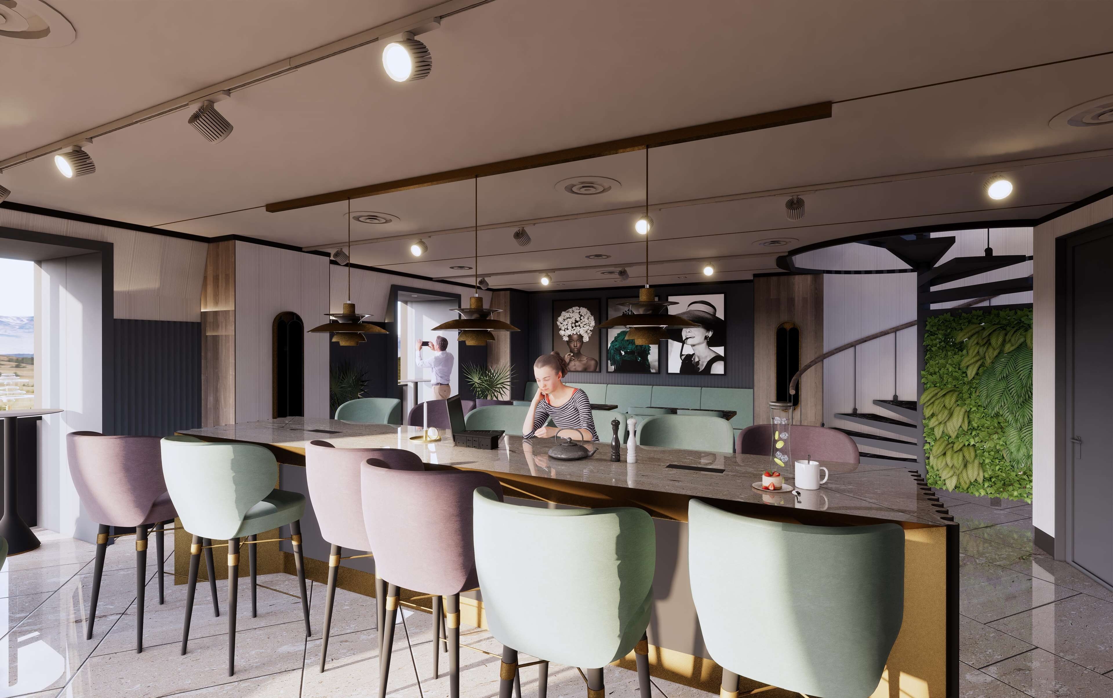 Une cuisine moderne dotée d’un îlot central, de sièges de bar et d’un escalier menant à un niveau supérieur.