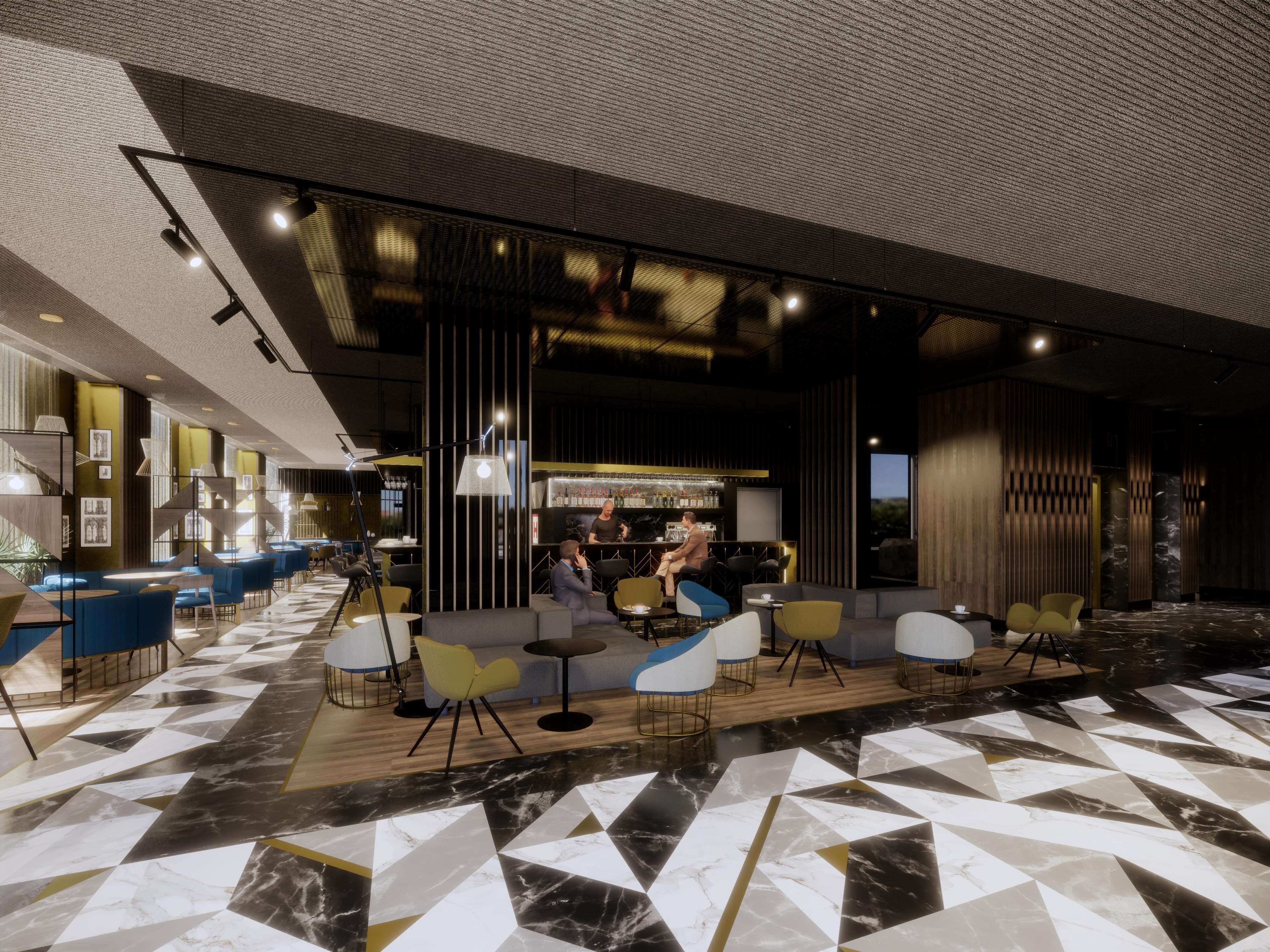 A modern interior with a bar area, seating with tables, and a patterned floor.