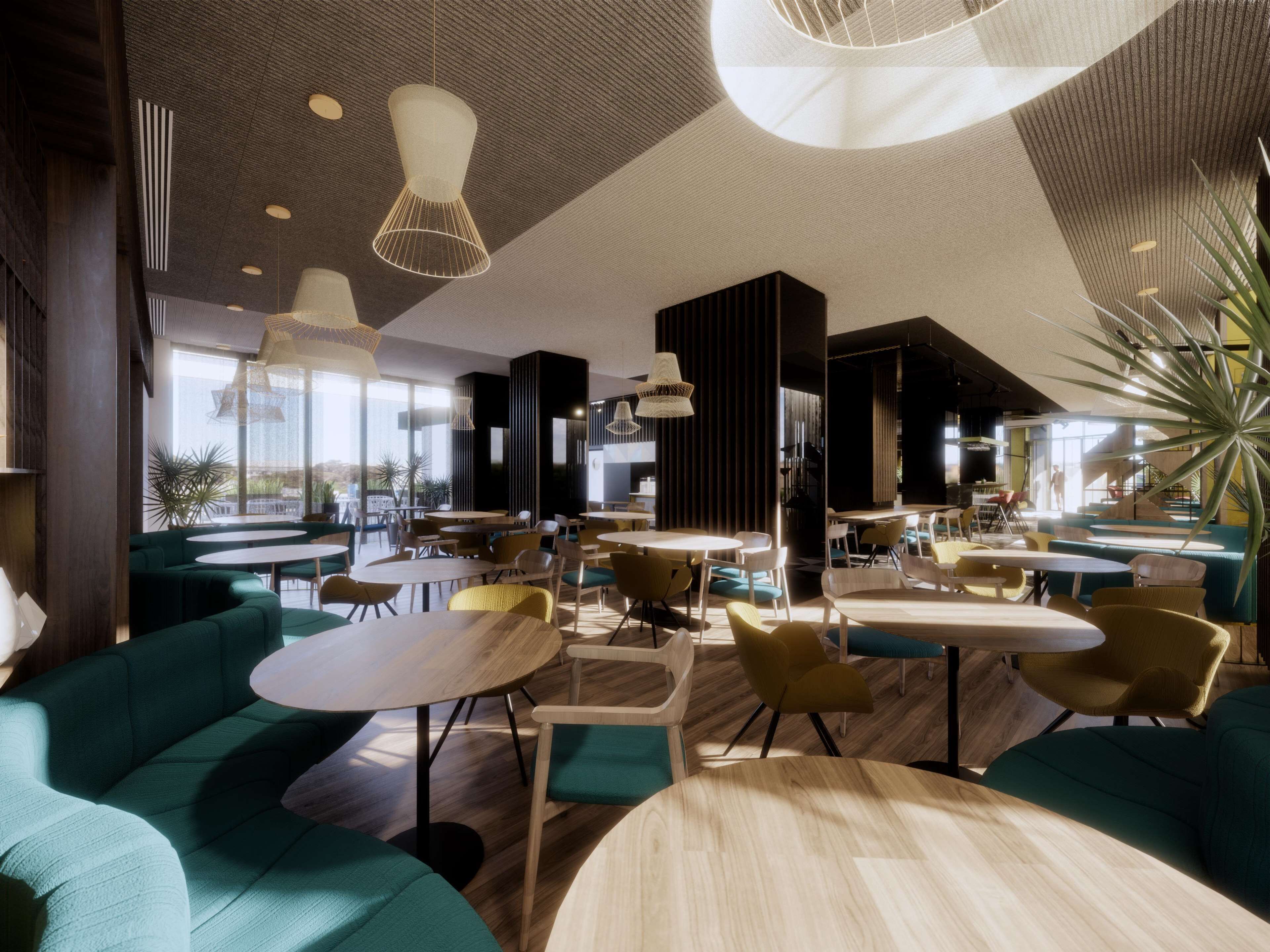 A modern interior with round tables and green sofas, large windows, and hanging light fixtures.