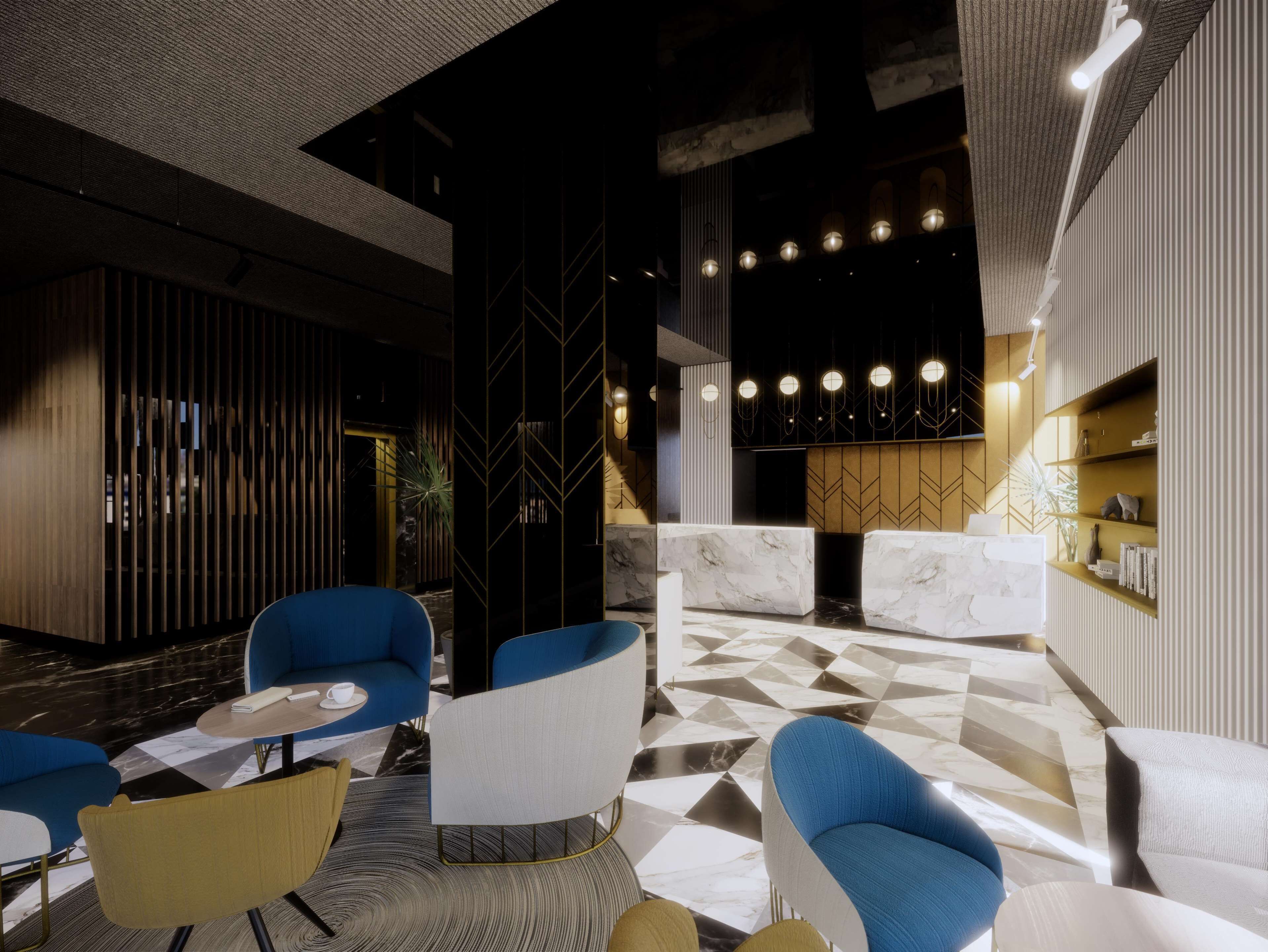 A modern lobby with a geometric patterned floor, blue and white seating, a reception desk, and a decorative wall with vertical lines.