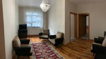 Comfort Condo | Living area | 42-inch TV with satellite channels