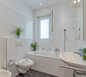 Family Apartment, Multiple Beds, 2 Bathrooms, Garden Area (La Luminosa) | Bathroom | Separate tub and shower, bidet, towels, soap