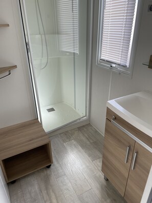 Shower, hair dryer, soap, toilet paper