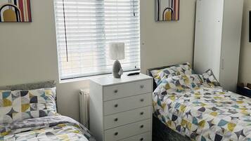 1 bedroom, desk, iron/ironing board, travel crib