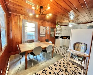 Cozy room with a dining table and kitchen area.