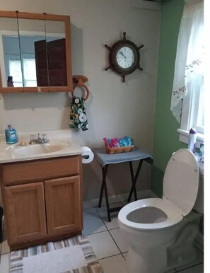 Bathtub, hair dryer, towels, soap