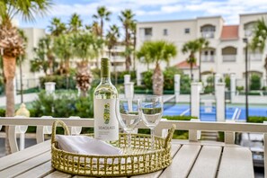 A bottle of Seaglass Pinot Grigio Central Coast 2021 on a table with two glasses.