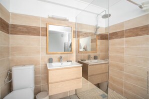 Shower, towels, soap, toilet paper