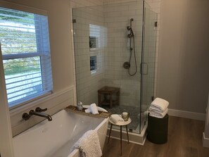Bathtub, hair dryer, towels, soap