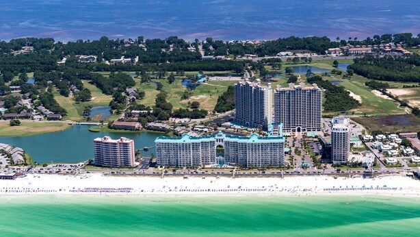 A coastal resort with multiple high-rise hotels, a beach, and a golf course. - Salty Siesta: Cozy Condo-Walk to Beach-Pools-Golf! (Miramar Beach)