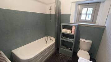 Bathtub, hair dryer, towels, soap