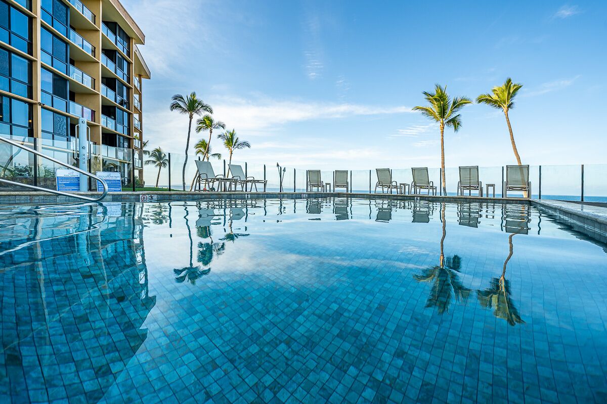 A heated pool, sun loungers