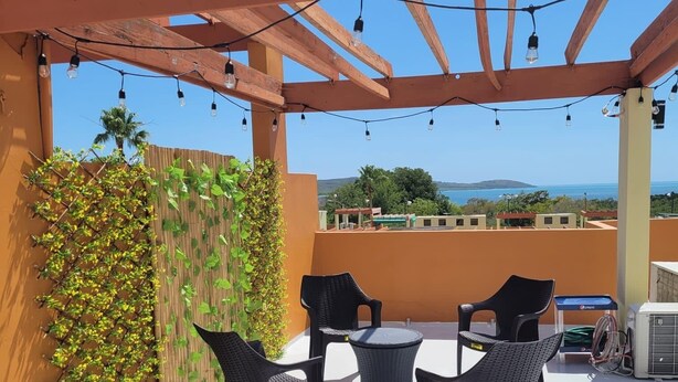 An outdoor patio with a pergola, chairs, and a table. - NEW! Walking distance to Boqueron ‘Poblado’, townhouse w/amazing views, sleeps 8 (Boqueron)