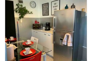 Fridge, microwave, stovetop, coffee/tea maker