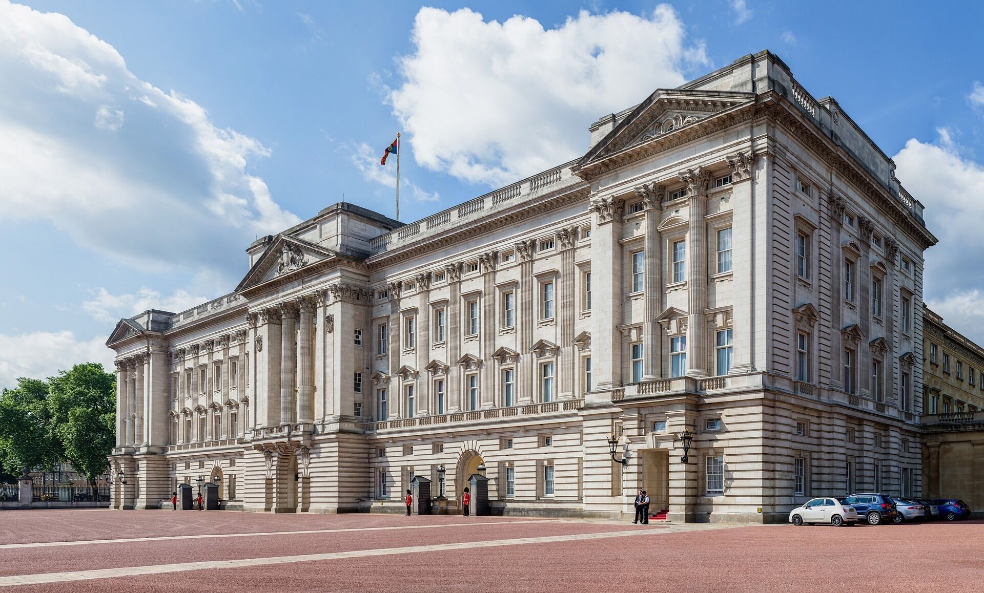A large, historic building with classical architecture, featuring a symmetrical facade, tall columns, and a prominent entrance.