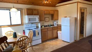 Fridge, coffee/tea maker, cookware/dishes/utensils